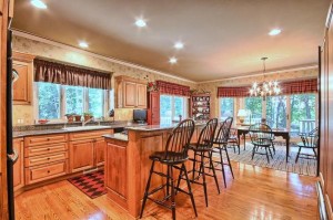 large kitchen with island and hardwood floors