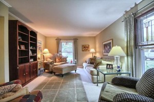 staged living room in Northville Commons home for sale